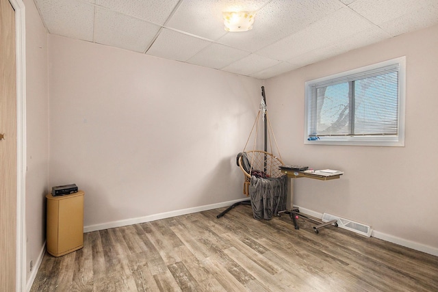 238-240 W Division St, Sparta, MI 49345 - unfurnished room featuring a drop ceiling, wood finished floors, and baseboards