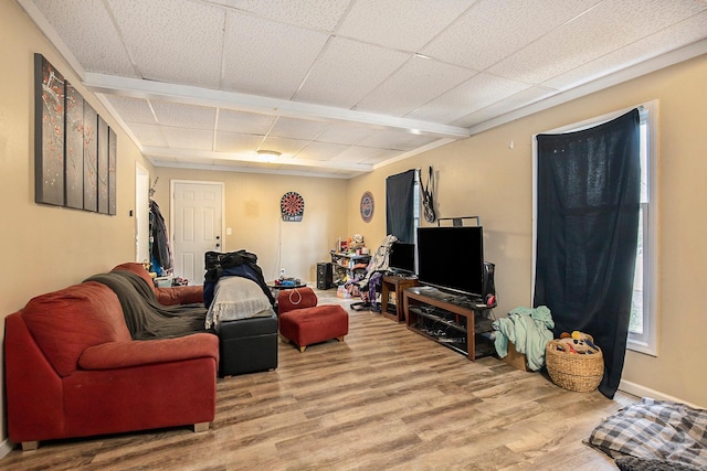 238-240 W Division St, Sparta, MI 49345 - living room with wood finished floors, a paneled ceiling, and baseboards