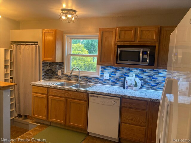 30664 Burlington St, Westland, MI 48186 - kitchen with white appliances, a sink, backsplash, and brown cabinets
