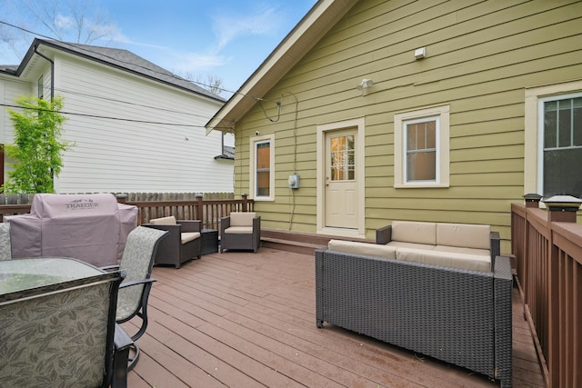 deck featuring an outdoor living space and area for grilling