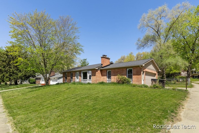 1169 Sluyter St SE, Grand Rapids, MI 49508 - single story home with brick siding, a garage, a chimney, and driveway
