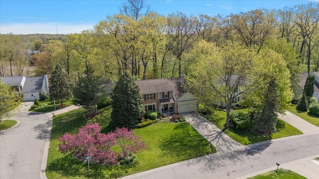 view from above of property with a forest