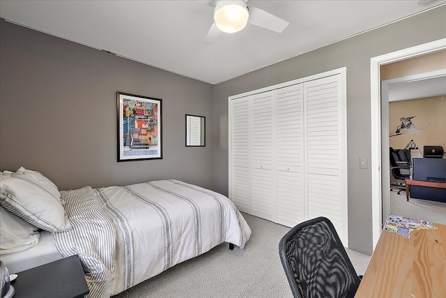 bedroom with light carpet, a closet, and ceiling fan