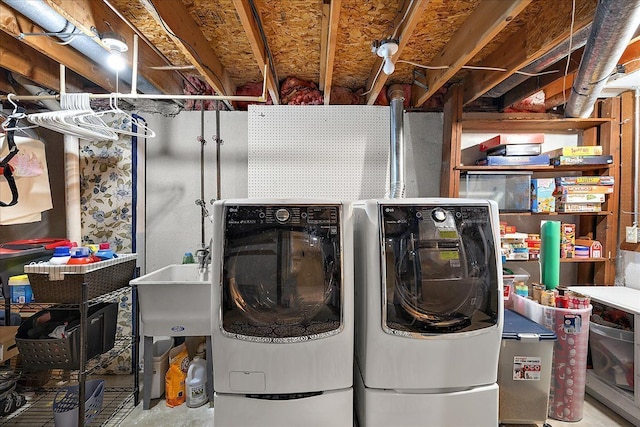 washroom with washing machine and clothes dryer