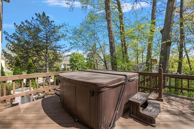 deck featuring a hot tub