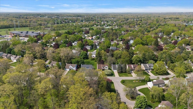 aerial view of property's location with a heavily wooded area