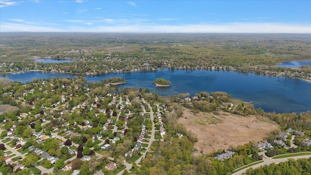 bird's eye view of a nearby body of water and a forest