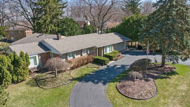 5080 Kitson Ln, West Bloomfield, MI 48324 - ranch-style house with driveway, a chimney, a front lawn, and roof with shingles