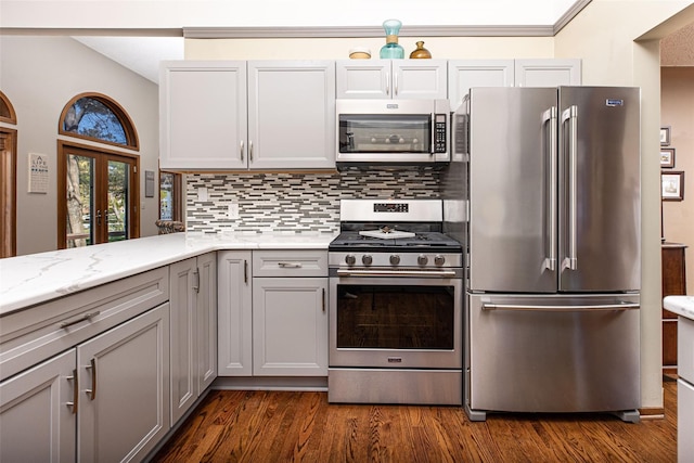 3541 Highland Blvd, Highland, MI 48356 - kitchen featuring appliances with stainless steel finishes, gray cabinets, tasteful backsplash, and dark wood-style floors