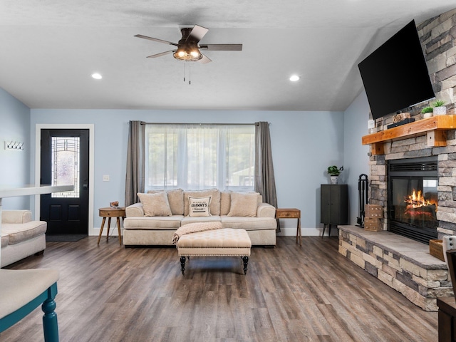 119 Maple St, Fife Lake, MI 49633 - living room with a fireplace, baseboards, wood finished floors, lofted ceiling, and ceiling fan
