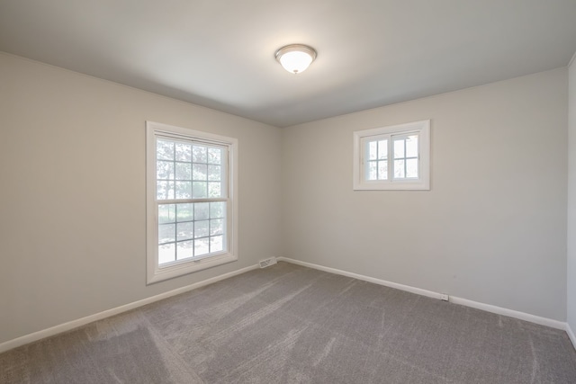 8345 Pontiac Lake Rd, White Lake, MI 48386 - unfurnished room featuring dark colored carpet and baseboards