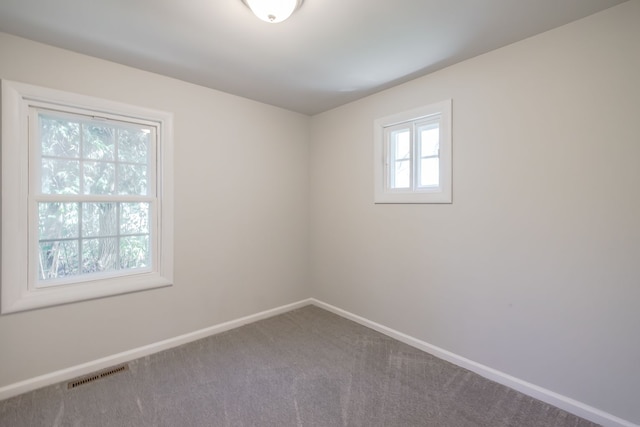 8345 Pontiac Lake Rd, White Lake, MI 48386 - carpeted spare room featuring baseboards