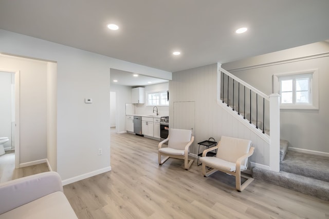 8345 Pontiac Lake Rd, White Lake, MI 48386 - living area with stairs, light wood finished floors, recessed lighting, and baseboards