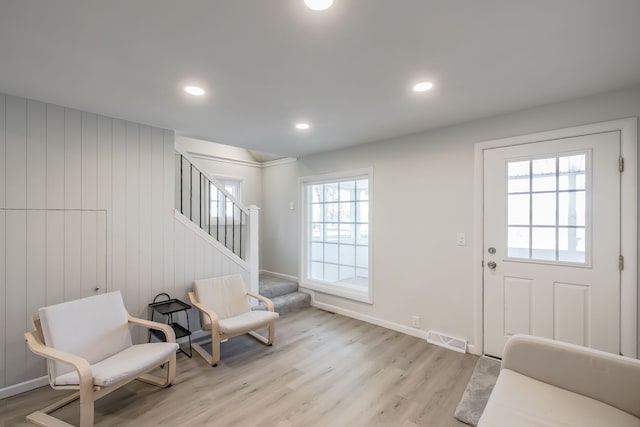 8345 Pontiac Lake Rd, White Lake, MI 48386 - entrance foyer featuring light wood-style floors, baseboards, stairs, and recessed lighting