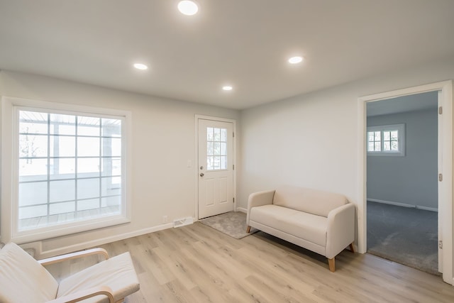 8345 Pontiac Lake Rd, White Lake, MI 48386 - living area featuring baseboards, light wood finished floors, and recessed lighting