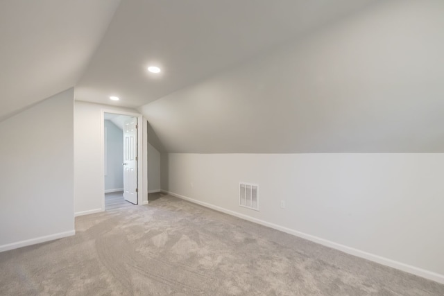 8345 Pontiac Lake Rd, White Lake, MI 48386 - additional living space with lofted ceiling, baseboards, carpet flooring, and recessed lighting