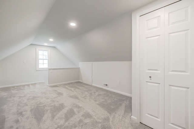 8345 Pontiac Lake Rd, White Lake, MI 48386 - bonus room featuring lofted ceiling, light colored carpet, baseboards, and recessed lighting