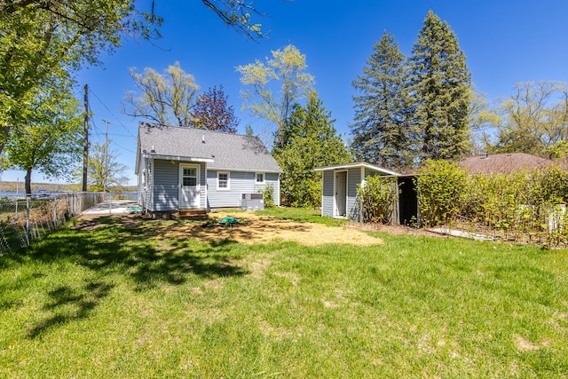 8345 Pontiac Lake Rd, White Lake, MI 48386 - back of property featuring a shed and an outdoor structure