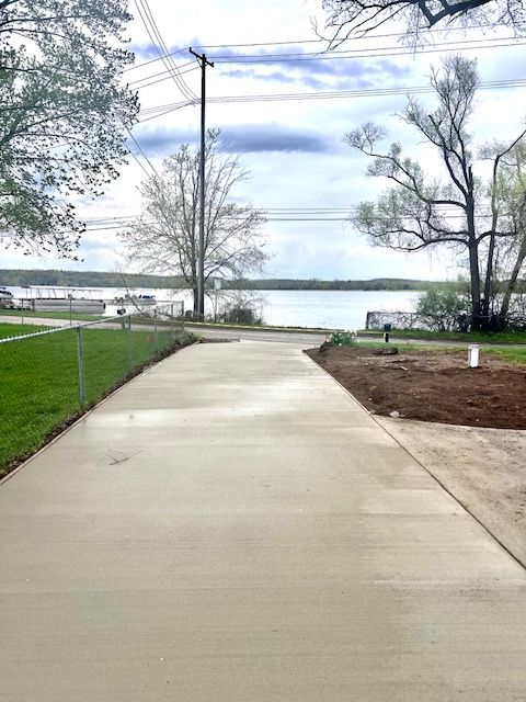8345 Pontiac Lake Rd, White Lake, MI 48386 - surrounding community featuring a water view and a yard