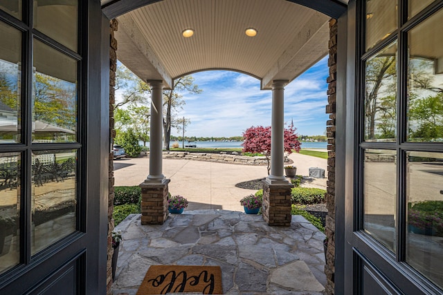 view of patio featuring a water view