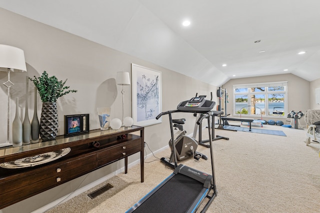exercise area with lofted ceiling, carpet floors, recessed lighting, baseboards, and a water view