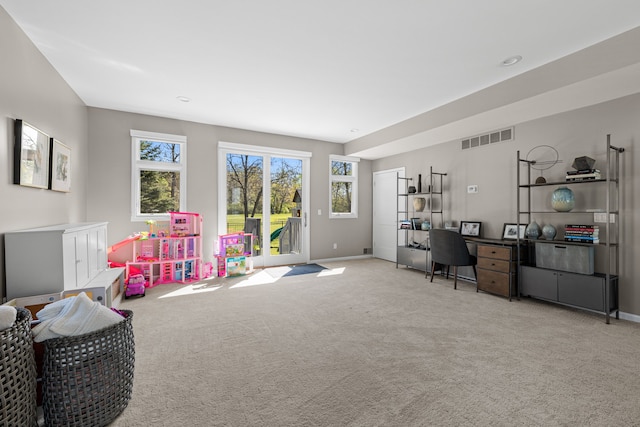 playroom with carpet floors and baseboards