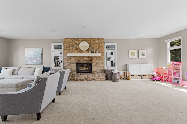 carpeted living area with a fireplace