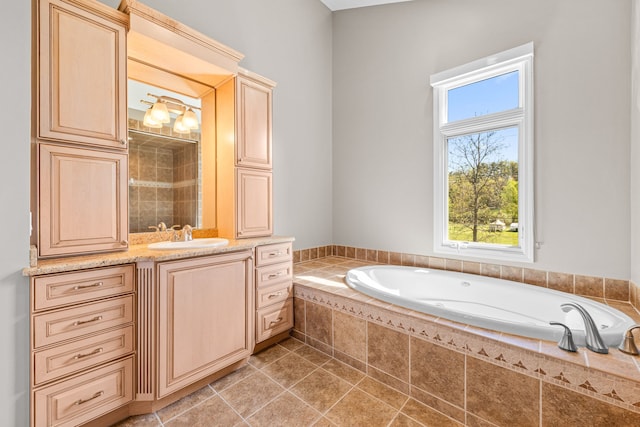 full bath with a bath, vanity, and tile patterned flooring