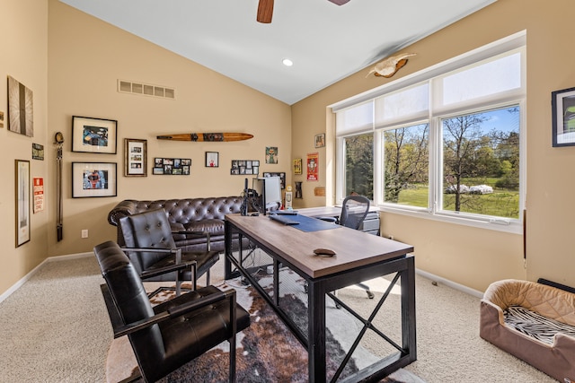 carpeted home office featuring baseboards, lofted ceiling, and ceiling fan