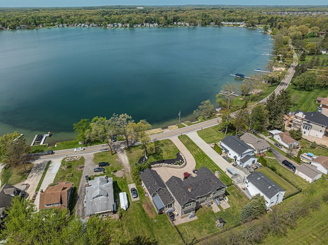 aerial overview of property's location with a large body of water and nearby suburban area