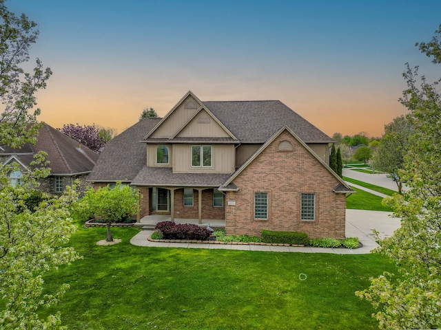 52201 Boland Rd, Chesterfield, MI 48047 - craftsman house featuring a porch, a front lawn, roof with shingles, and brick siding