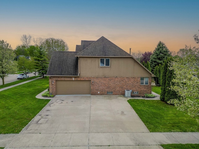 52201 Boland Rd, Chesterfield, MI 48047 - view of front facade featuring brick siding, central AC, a lawn, driveway, and roof with shingles