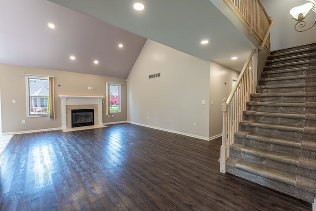 52201 Boland Rd, Chesterfield, MI 48047 - unfurnished living room with stairs, high vaulted ceiling, dark wood-type flooring, baseboards, and recessed lighting
