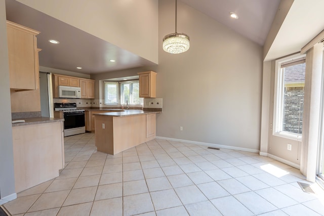 52201 Boland Rd, Chesterfield, MI 48047 - kitchen featuring white appliances, light brown cabinetry, a peninsula, recessed lighting, and baseboards