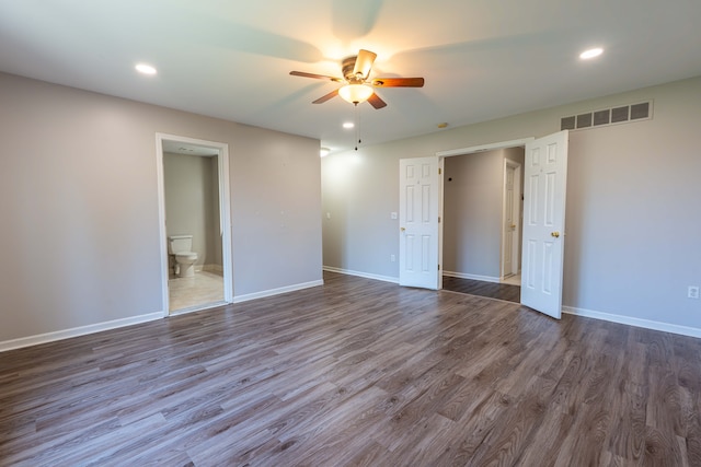 52201 Boland Rd, Chesterfield, MI 48047 - unfurnished bedroom with dark wood-type flooring, baseboards, recessed lighting, connected bathroom, and ceiling fan