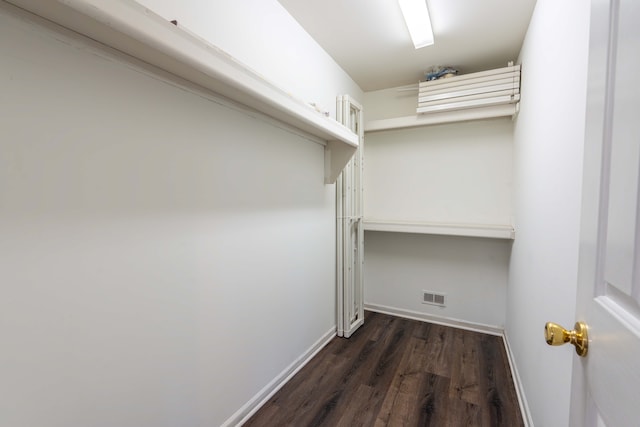 52201 Boland Rd, Chesterfield, MI 48047 - laundry area with dark wood finished floors and baseboards