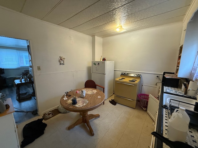 1917 16th St, Port Huron, MI 48060 - kitchen with range with electric cooktop and freestanding refrigerator