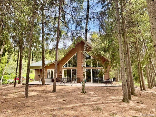 5793 Gark Rd, Attica, MI 48412 - back of property with a patio area