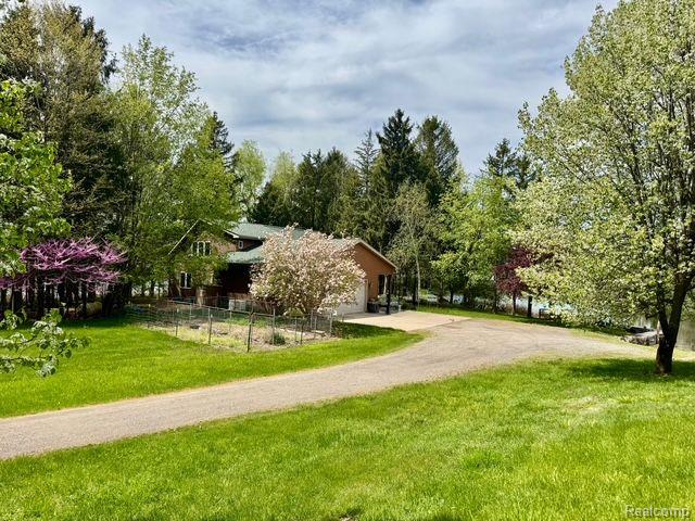5793 Gark Rd, Attica, MI 48412 - view of yard with driveway and an attached garage