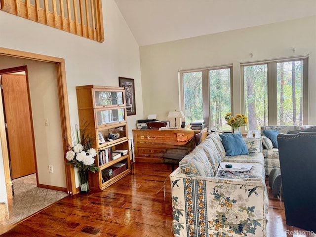 5793 Gark Rd, Attica, MI 48412 - living area with hardwood / wood-style floors, high vaulted ceiling, and baseboards