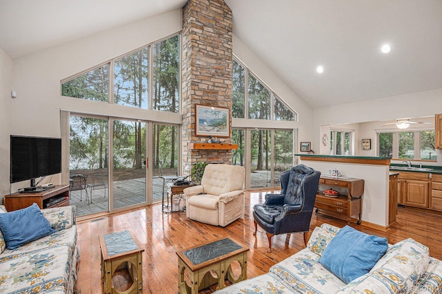 5793 Gark Rd, Attica, MI 48412 - living room with high vaulted ceiling, healthy amount of natural light, light wood finished floors, a ceiling fan, and recessed lighting