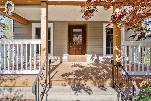 doorway to property with covered porch
