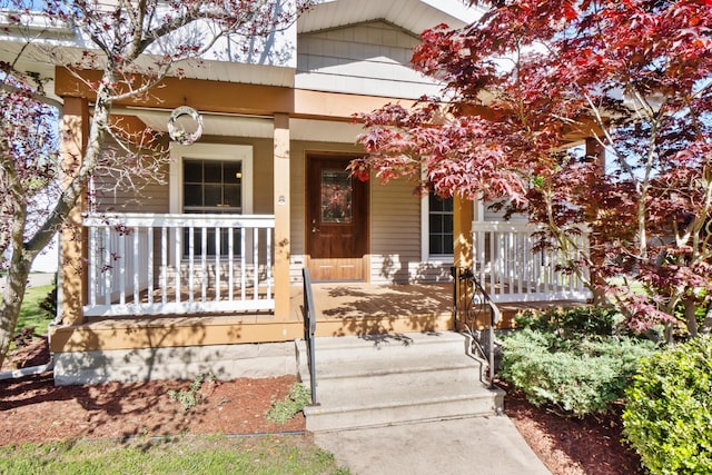 doorway to property with a porch