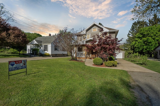 view of front of property with a front yard and covered porch