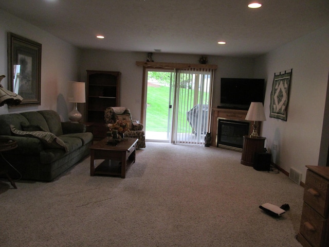 2625 Rolling Ridge Ln NW, Grand Rapids, MI 49534 - living room with carpet floors, recessed lighting, and a glass covered fireplace