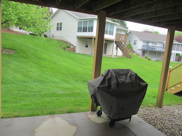 2625 Rolling Ridge Ln NW, Grand Rapids, MI 49534 - view of grassy yard featuring stairs, a sunroom, and a deck