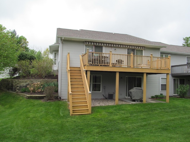 2625 Rolling Ridge Ln NW, Grand Rapids, MI 49534 - back of house with a deck, stairs, a lawn, and cooling unit