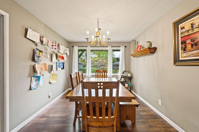 2655 Tanbark Trl, Saint Joseph, MI 49085 - dining area featuring a chandelier, dark wood-type flooring, baseboards, and a textured ceiling