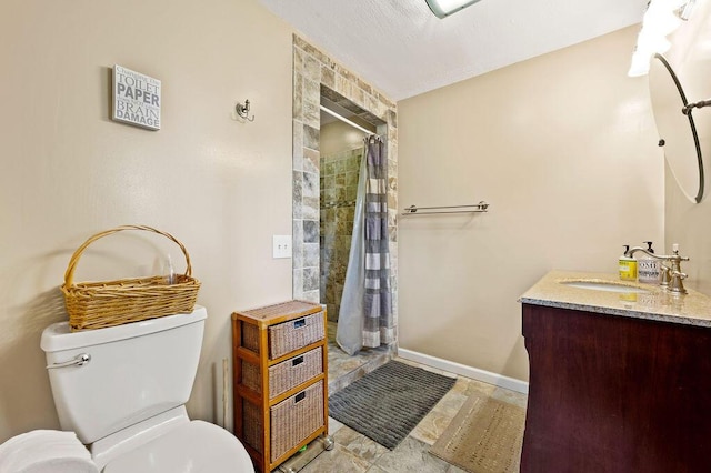2655 Tanbark Trl, Saint Joseph, MI 49085 - bathroom with toilet, tiled shower, vanity, and baseboards