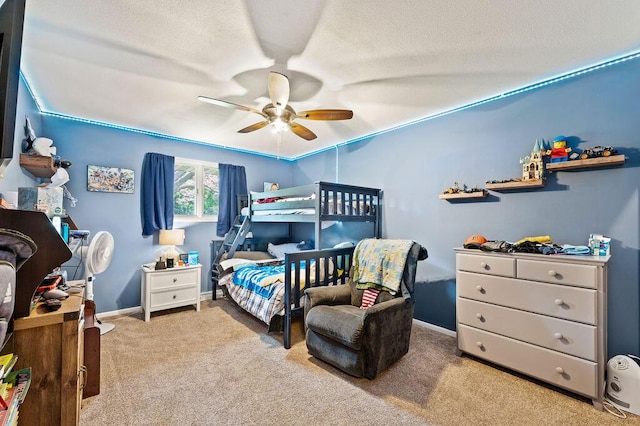 2655 Tanbark Trl, Saint Joseph, MI 49085 - bedroom featuring carpet floors, baseboards, ceiling fan, and a textured ceiling